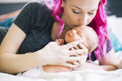 Mother holding newborn son (2-5 months)