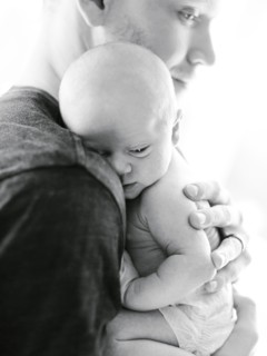 Portrait one day baby boy (0-1 months) being hold by his father