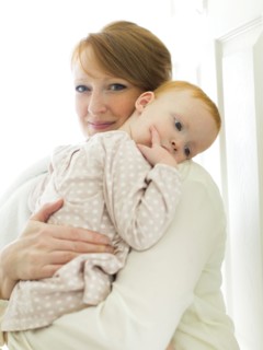Portrait of mother embracing daughter ( 12-17 months )