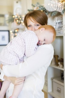 Portrait of mother embracing daughter ( 12-17 months )