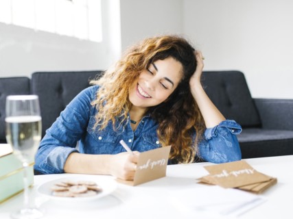 Woman handwriting in living room