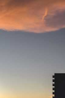 Silhouette of apartment building at dusk