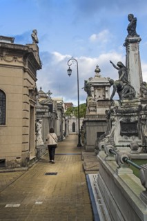 Argentina, Buenos Aires, Woman walking through Recoleta Cemetery