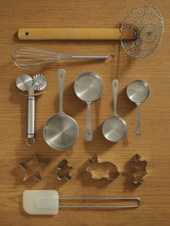 Studio shot of kitchen utensils on wooden table