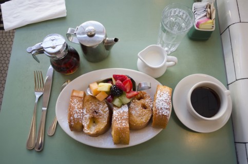 Plate with fresh french toasts and fruits
