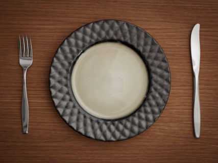 Studio shot of plate with fork and knife