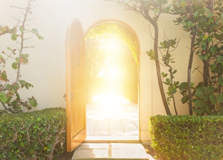 Building exterior with backlit doorway