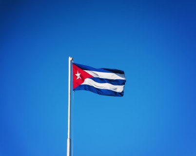 Cuba, Havana, Cuban flag with blue sky
