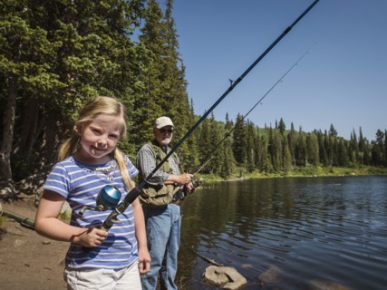 USA, Utah, Lake City, Girl (4-5) with grandfather fishing in lake