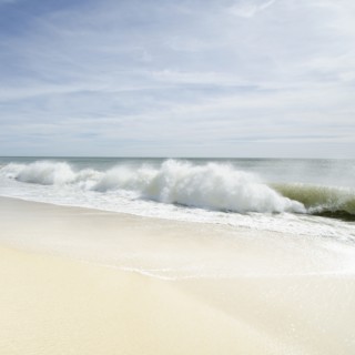 Sandy beach with waves