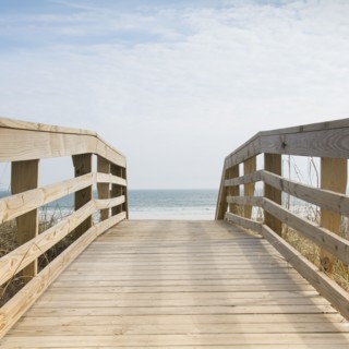 Wooden boardwalk by sea