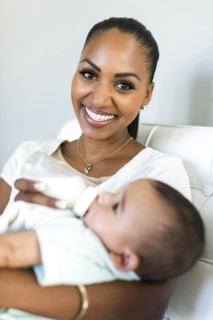 Portrait of mother feeding baby boy (2-5 months)