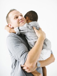 Father holding son (2-3)