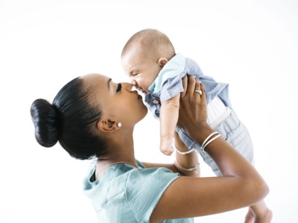 Mother holding baby boy (2-5 months)