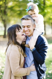 Parents with daughter (12-17 months) in park