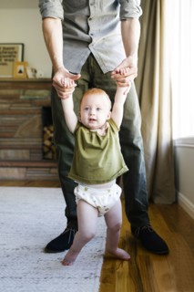 Father walking with daughter (12-17 months)