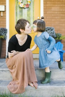 Mother kissing daughter (2-3)