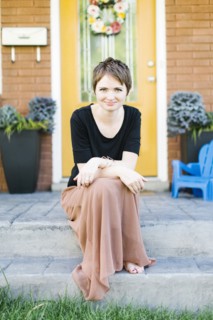 Portrait of woman sitting on step