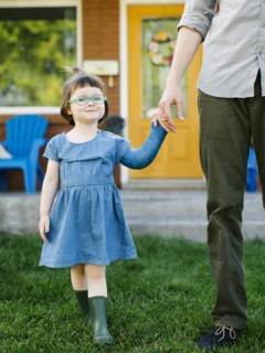Daughter (2-3) walking with father
