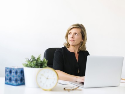 Pensive Mature woman in office