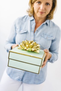 Portrait of Mature woman holding gift
