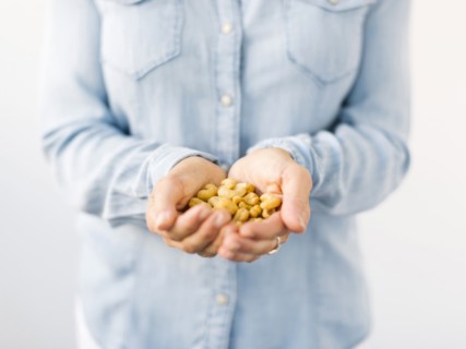 Woman holding handful of nuts