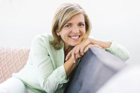 Portrait of woman sitting on sofa