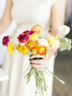 Woman holding bunch of flowers