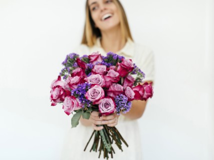 Woman holding bouquet of roses