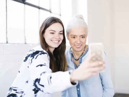 Daughter and mother making selfie