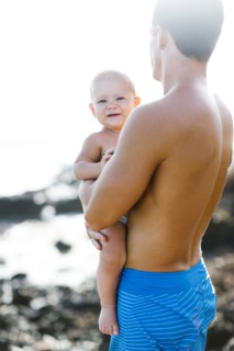 Man holding baby son (18-23 months)