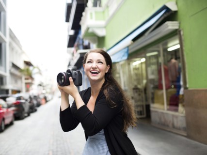 Puerto Rico, San Juan, Woman photographing on street