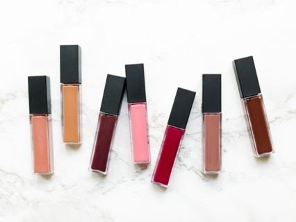 Lip glosses on marble background