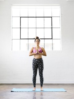 Woman practicing yoga on exercise mat