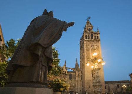 Spain, Seville, Plaza Virgin De Los Reyes, Statue and Girlada Tower