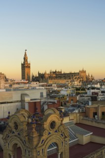 Spain, Seville, Cityscape with Cathedral of Seville at sunset