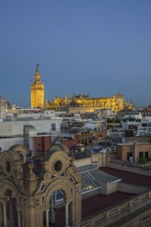 Spain, Seville, Cityscape with Cathedral of Seville at sunset
