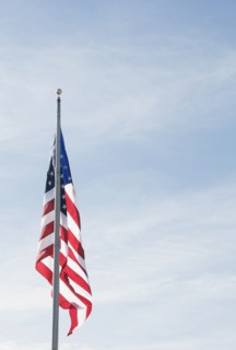 American flag against blue sky