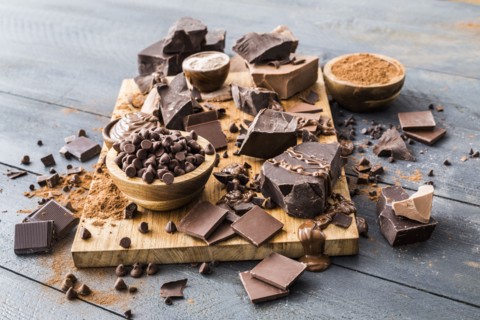 Various chocolate pieces on cutting board