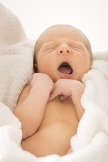 Newborn boy (0-1 month) yawning
