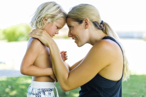 Mother with son (4-5) embracing