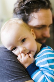 Father embracing son (12-17 months)