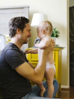Father holding son (12-17 months)