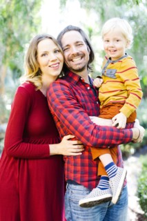Portrait of parents with son (4-5) in park