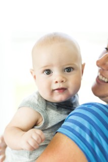 Mother holding son (6-11 months)