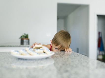 Brother (6-7) reaching for cookies