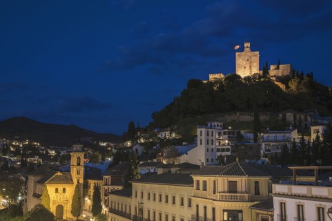 Spain, Andalusia, Granada, Plaza Nueva, Palace of Alhambra on hill at night
