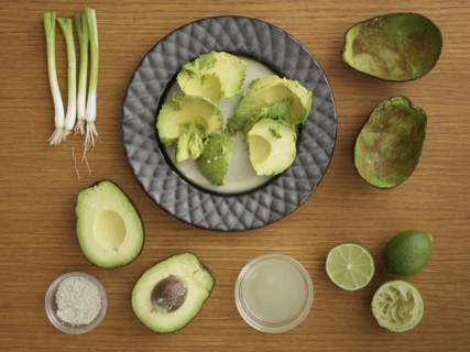 Studio shot of avocado, lime and scallion for guacamole