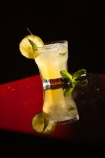 Yellow cocktail with mint leaf