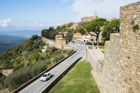 Italy, Tuscany, Montalcino, View of ancient Montalcino city and fortress walls on hill